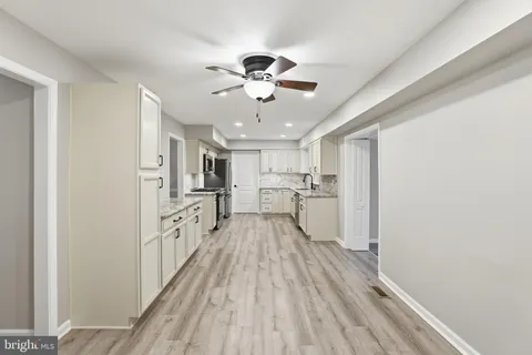 a view of a kitchen with wooden floor