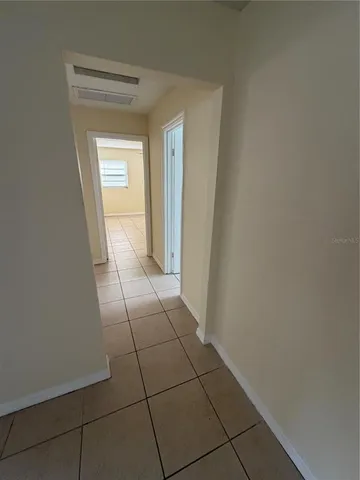 a view of a livingroom and a hallway