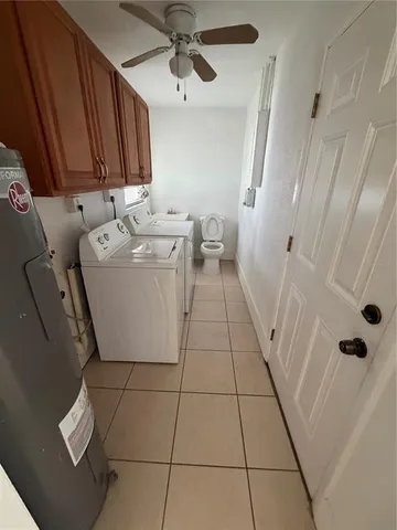 a bathroom with a sink a toilet and a shower