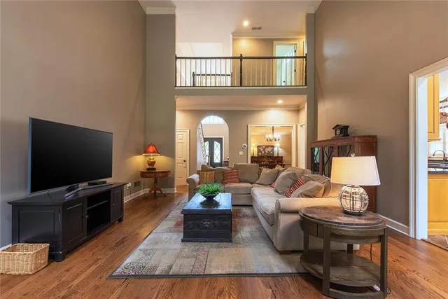 a kitchen with stainless steel appliances granite countertop a stove a sink dishwasher and a refrigerator
