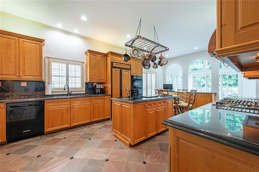 3854 Sidestreet Atlanta, GA 30341 - Photo 17 of 83 a kitchen with stainless steel appliances granite countertop a sink a stove top oven a counter space and cabinets
