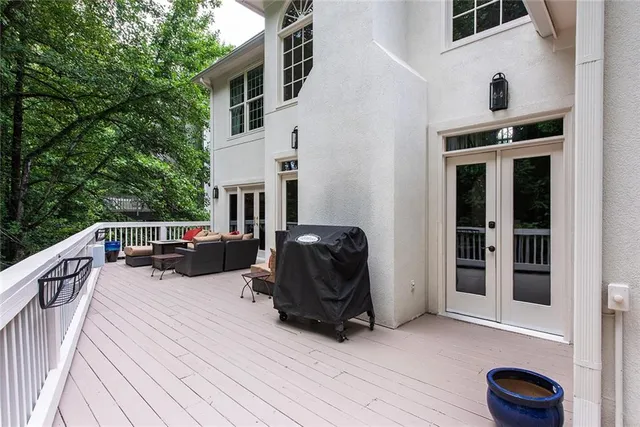 a bathroom with a tub a sink a mirror and a shower