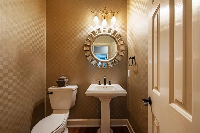 a living room with a bed furniture and a large window