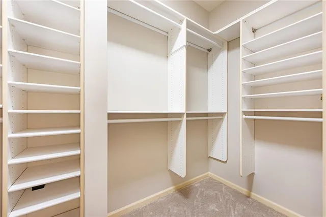 a bathroom with a granite countertop sink vanity mirror and a