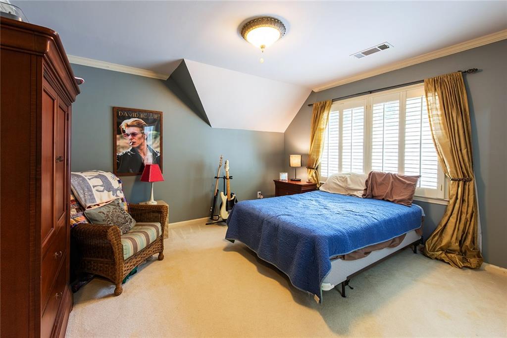 3854 Sidestreet Atlanta, GA 30341 - Photo 53 of 83 a bedroom with a bed and wooden floor