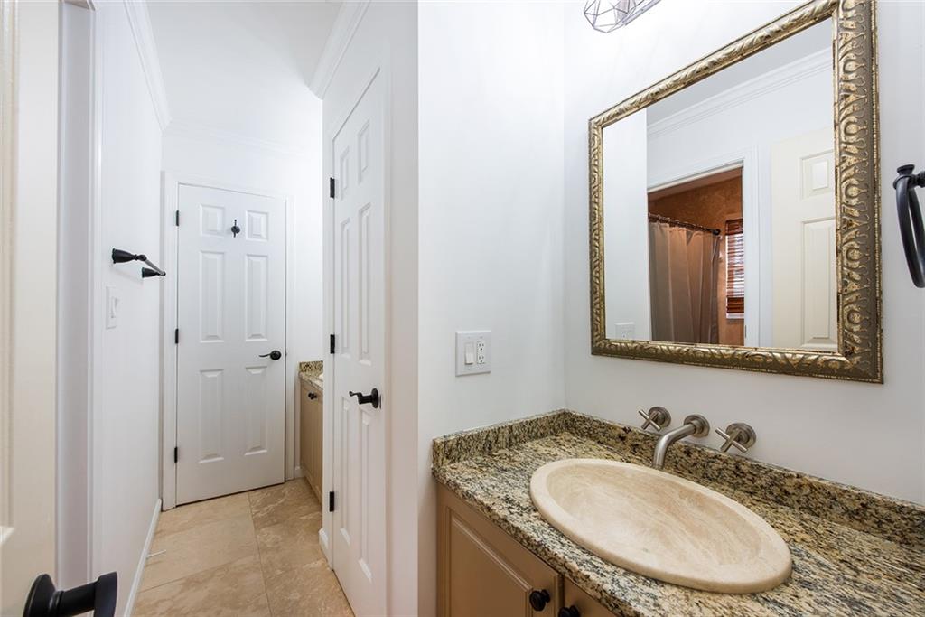 3854 Sidestreet Atlanta, GA 30341 - Photo 55 of 83 a bathroom with a granite countertop sink vanity mirror and a