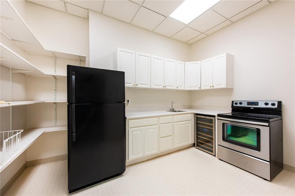 3854 Sidestreet Atlanta, GA 30341 - Photo 60 of 83 a kitchen with a refrigerator stove and microwave