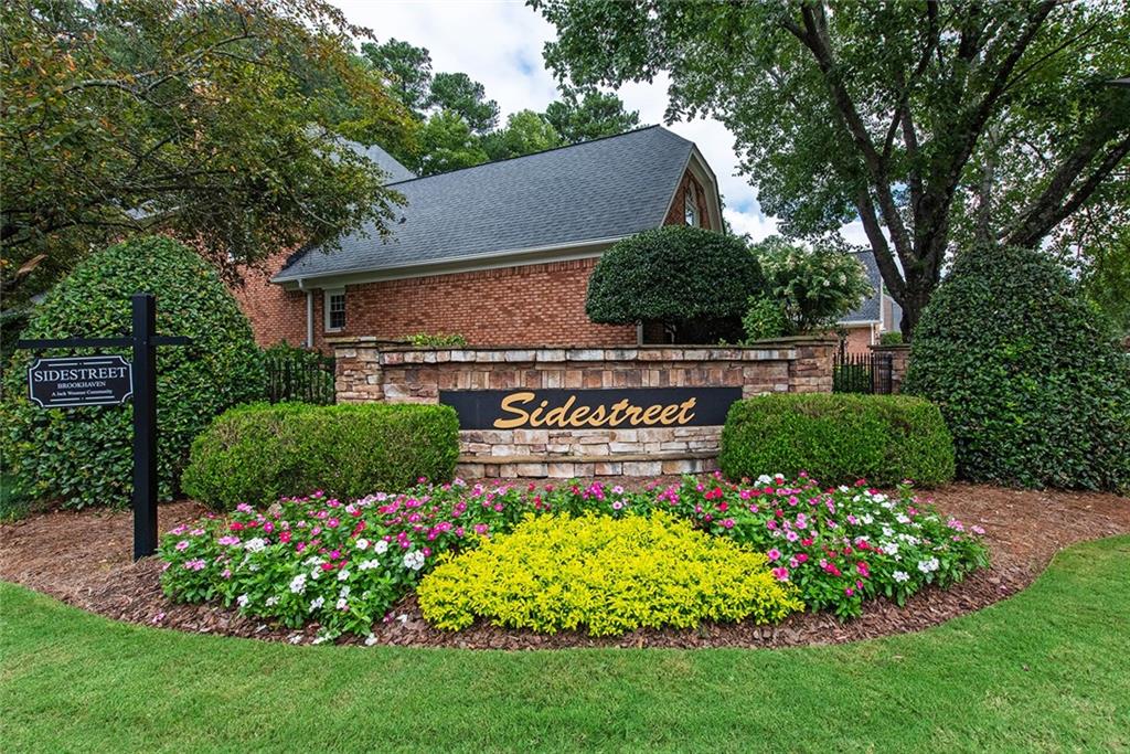 3854 Sidestreet Atlanta, GA 30341 - Photo 83 of 83 a view of a sign board with flower garden and wooden fence