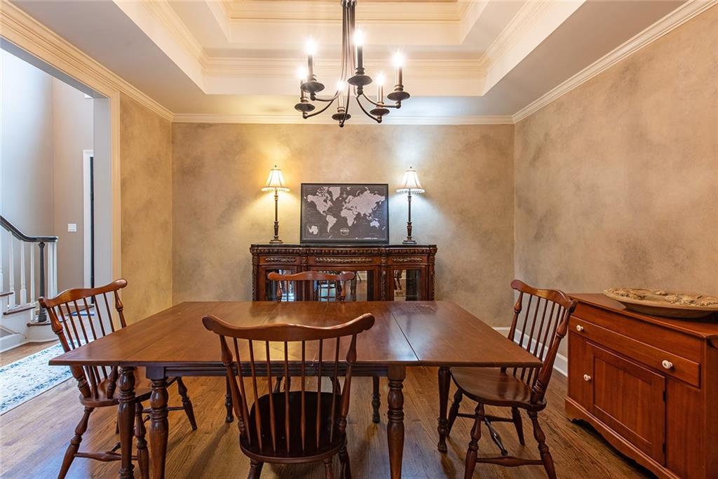 3854 Sidestreet Atlanta, GA 30341 - Photo 10 of 83 a view of a dining room with furniture wooden floor and chandelier