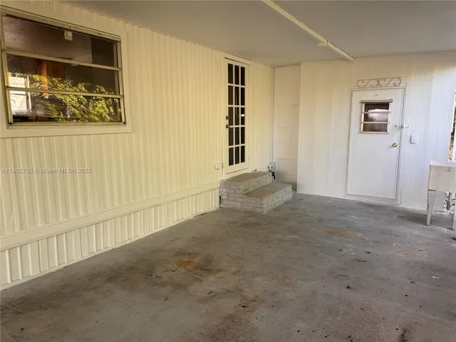 en empty room with windows