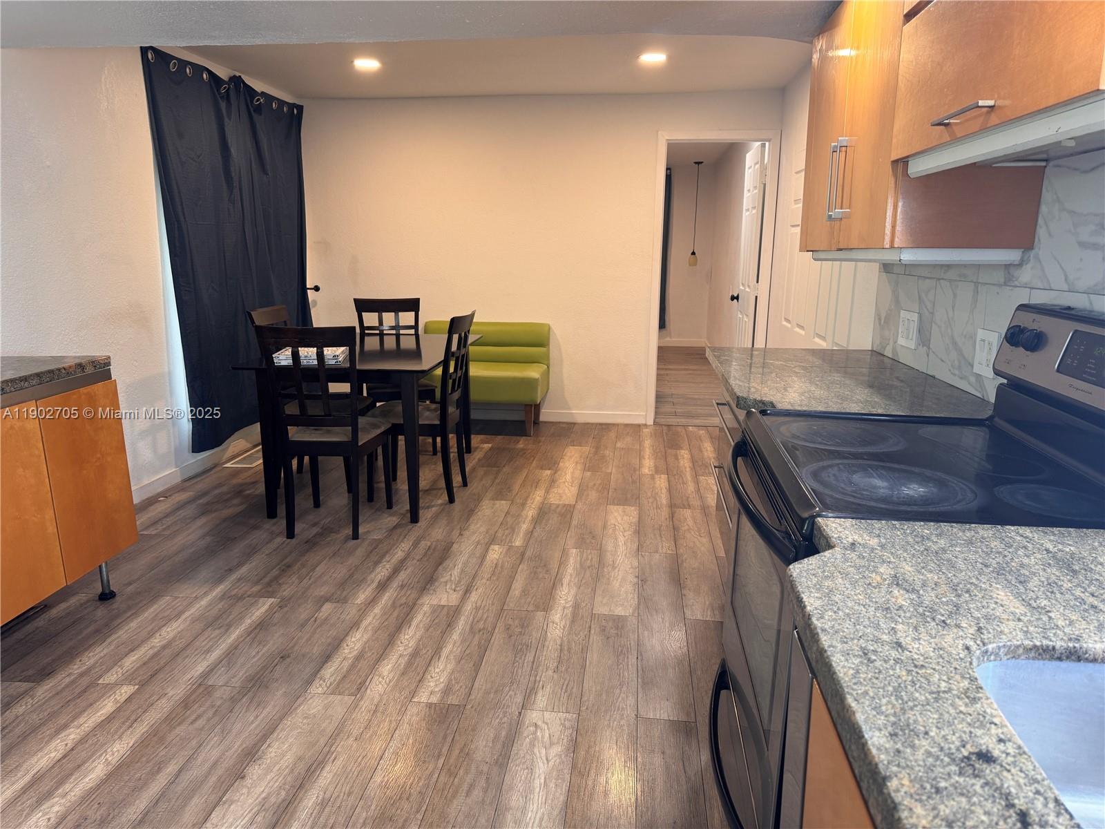 5331 Southwest 35th Street Davie, FL 33314 - Photo 2 of 21 a kitchen with a table and chairs in it