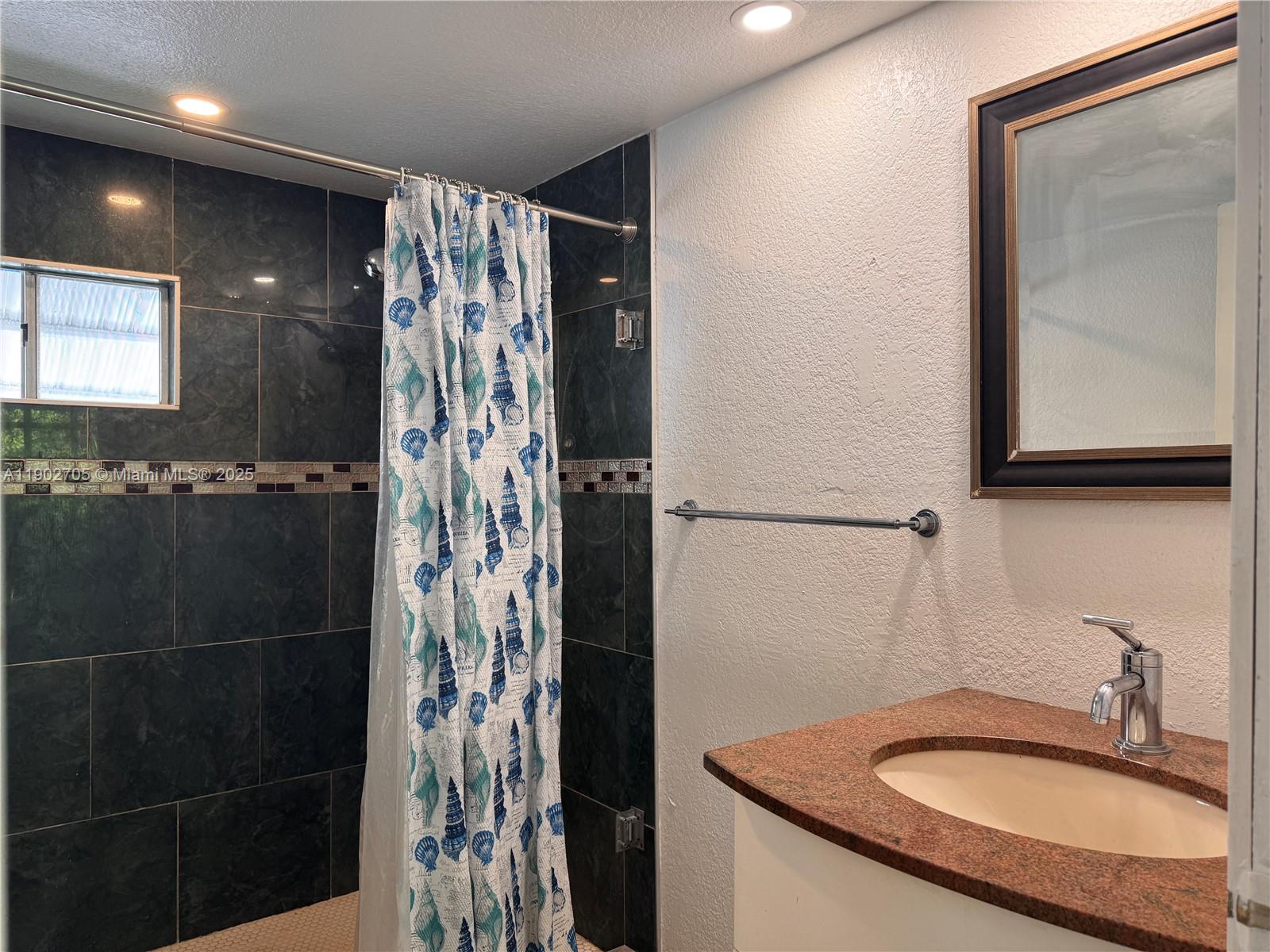 5331 Southwest 35th Street Davie, FL 33314 - Photo 6 of 21 a bathroom with a sink and a mirror