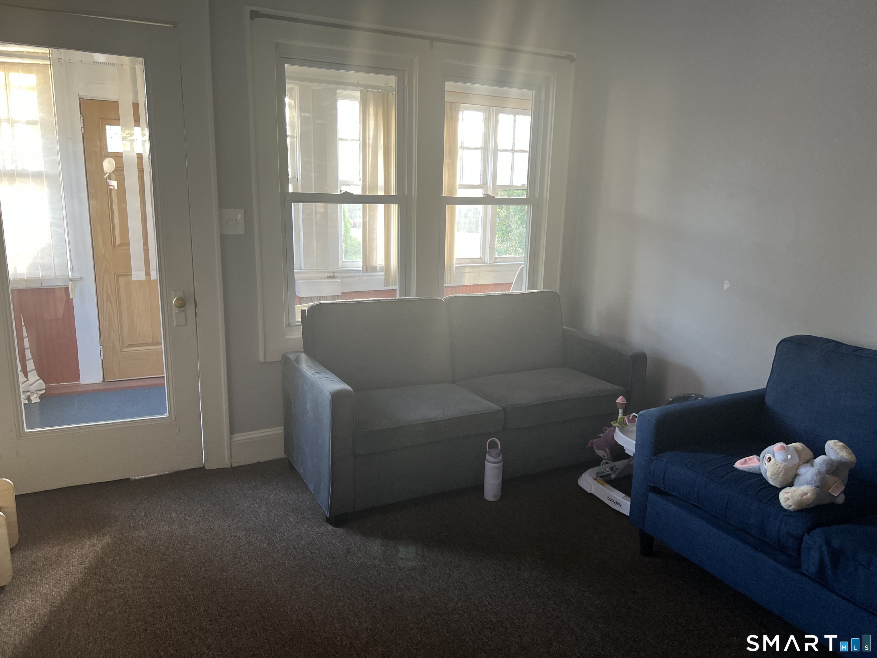 275 Long Ridge Road Stamford, CT 06905 - Photo 6 of 40 a living room with furniture and a window