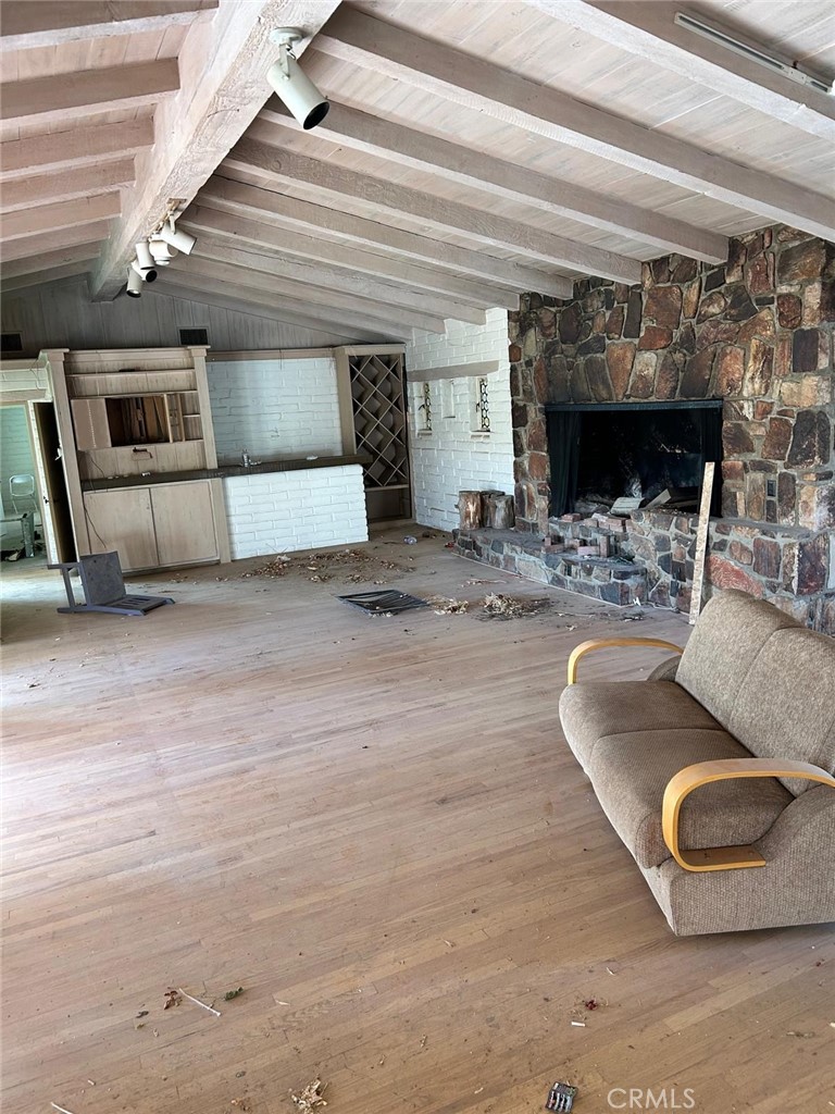 20572 Rancherias Road Apple Valley, CA 92307 - Photo 2 of 11 a living room with furniture and a fireplace