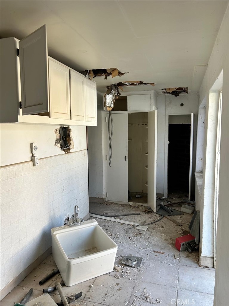 20572 Rancherias Road Apple Valley, CA 92307 - Photo 6 of 11 a bathroom with a sink and a mirror