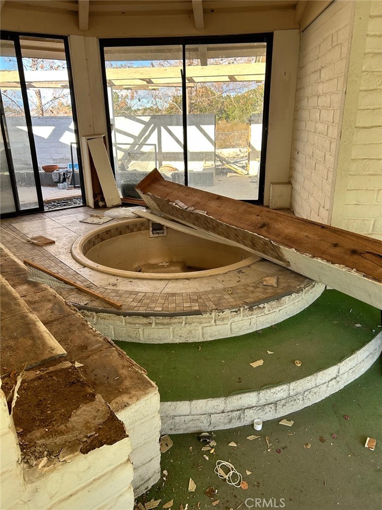 20572 Rancherias Road Apple Valley, CA 92307 - Photo 8 of 11 a view of swimming pool from a window