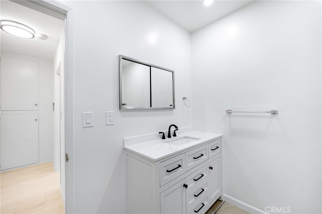580 West Stocker Street, Unit 6 Glendale, CA 91202 - Photo 17 of 17 a bathroom with a sink and a mirror