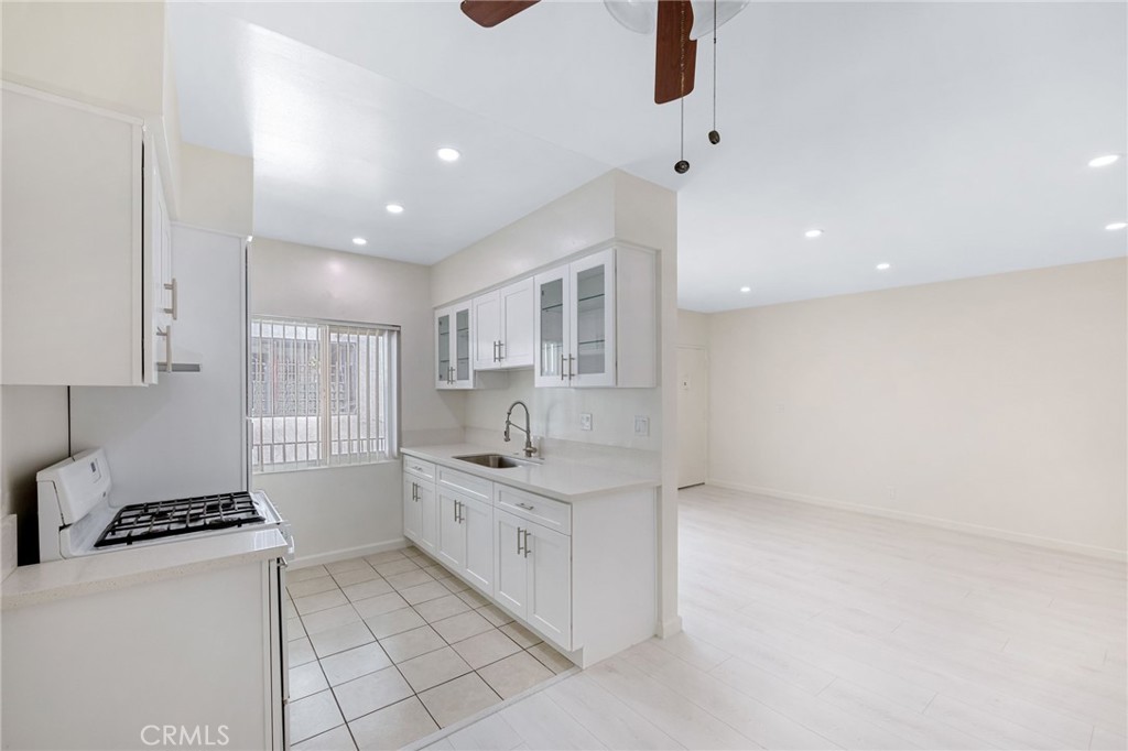 580 West Stocker Street, Unit 6 Glendale, CA 91202 - Photo 2 of 17 a kitchen with stainless steel appliances a sink stove and cabinets