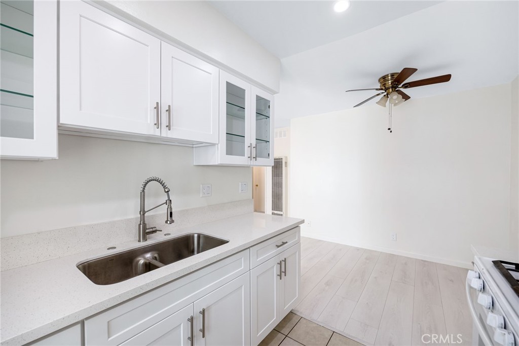 580 West Stocker Street, Unit 6 Glendale, CA 91202 - Photo 9 of 17 a kitchen with stainless steel appliances a sink a refrigerator and cabinets
