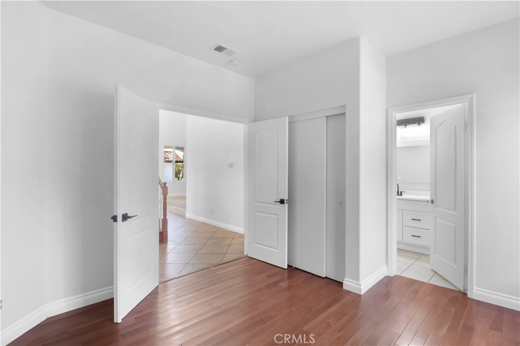 11189 Summerside Lane Rancho Cucamonga, CA 91737 - Photo 13 of 30 wooden floor with white walls