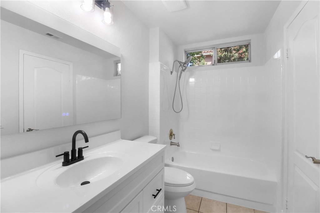 11189 Summerside Lane Rancho Cucamonga, CA 91737 - Photo 14 of 30 a bathroom with a sink a toilet and a bathtub