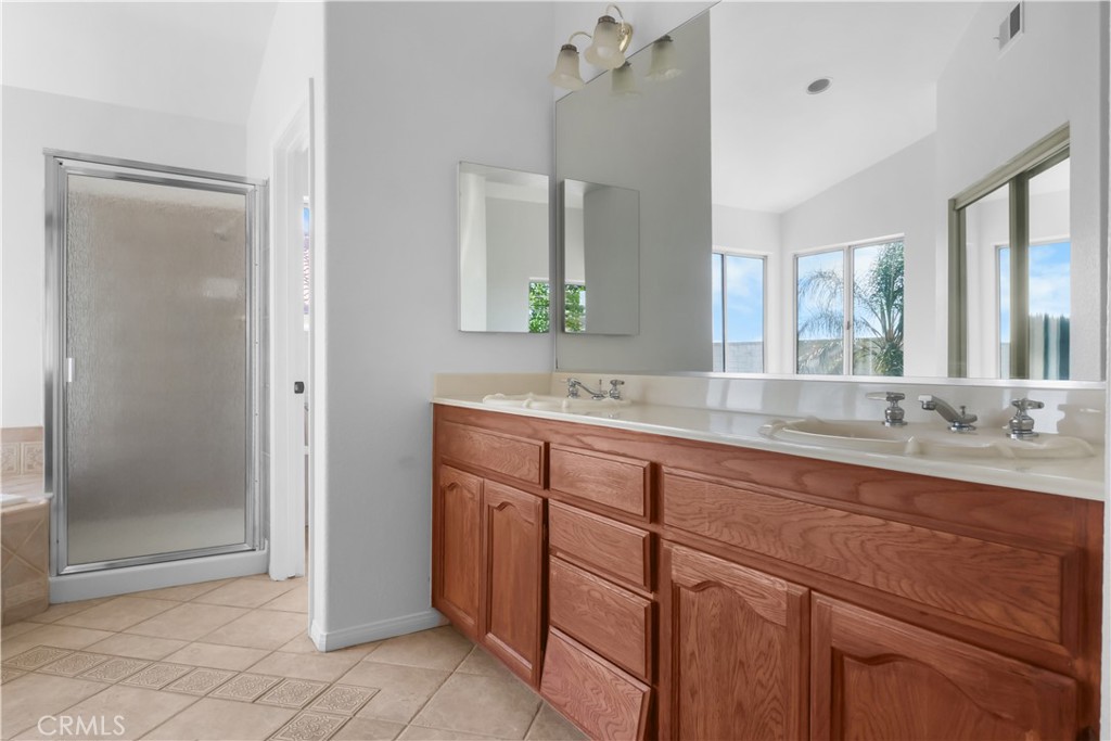11189 Summerside Lane Rancho Cucamonga, CA 91737 - Photo 20 of 30 a bathroom with a granite countertop sink mirror and double