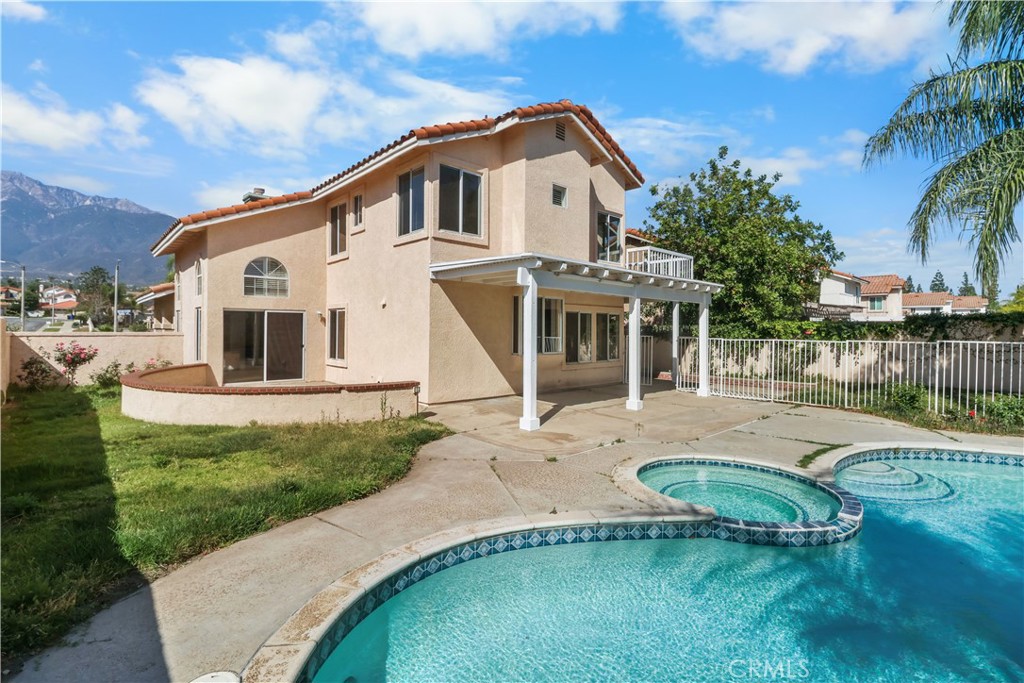11189 Summerside Lane Rancho Cucamonga, CA 91737 - Photo 28 of 30 a view of a white house with a big yard and potted plants