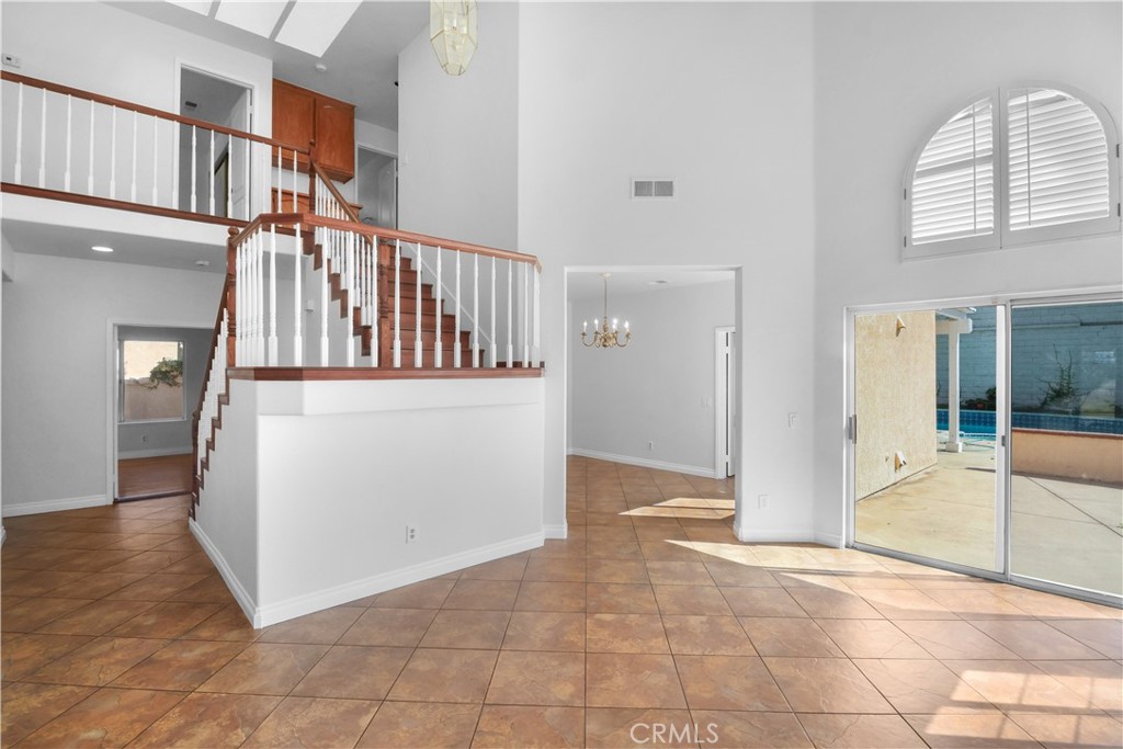 11189 Summerside Lane Rancho Cucamonga, CA 91737 - Photo 5 of 30 a view of a hallway with entryway and wooden floor