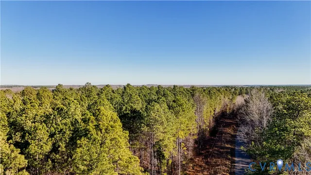 a view of a large body of water with a building in the background