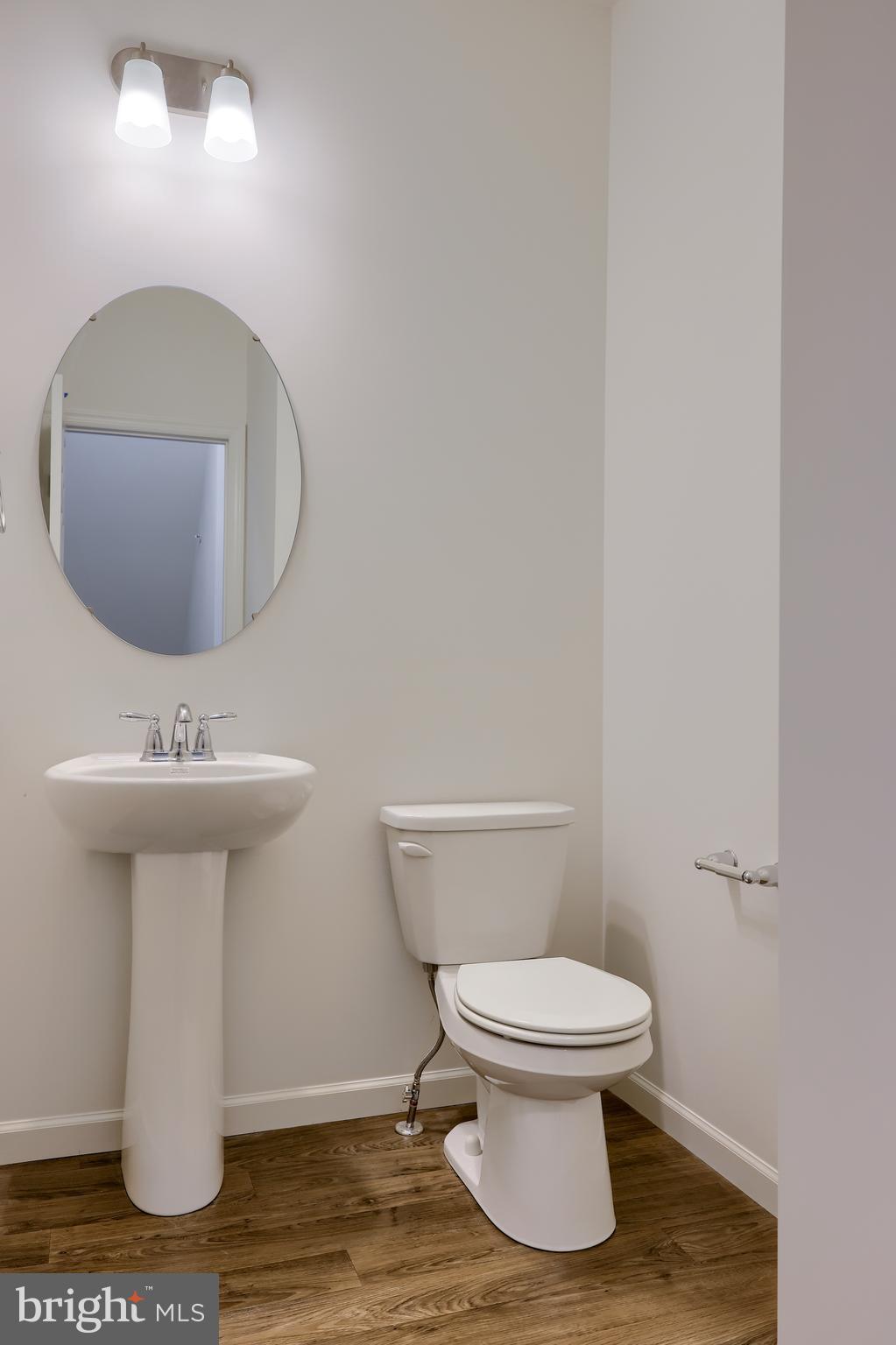 2417 Spring Water Circle Lancaster, PA 17601 - Photo 14 of 35 a bathroom with a toilet a sink and mirror