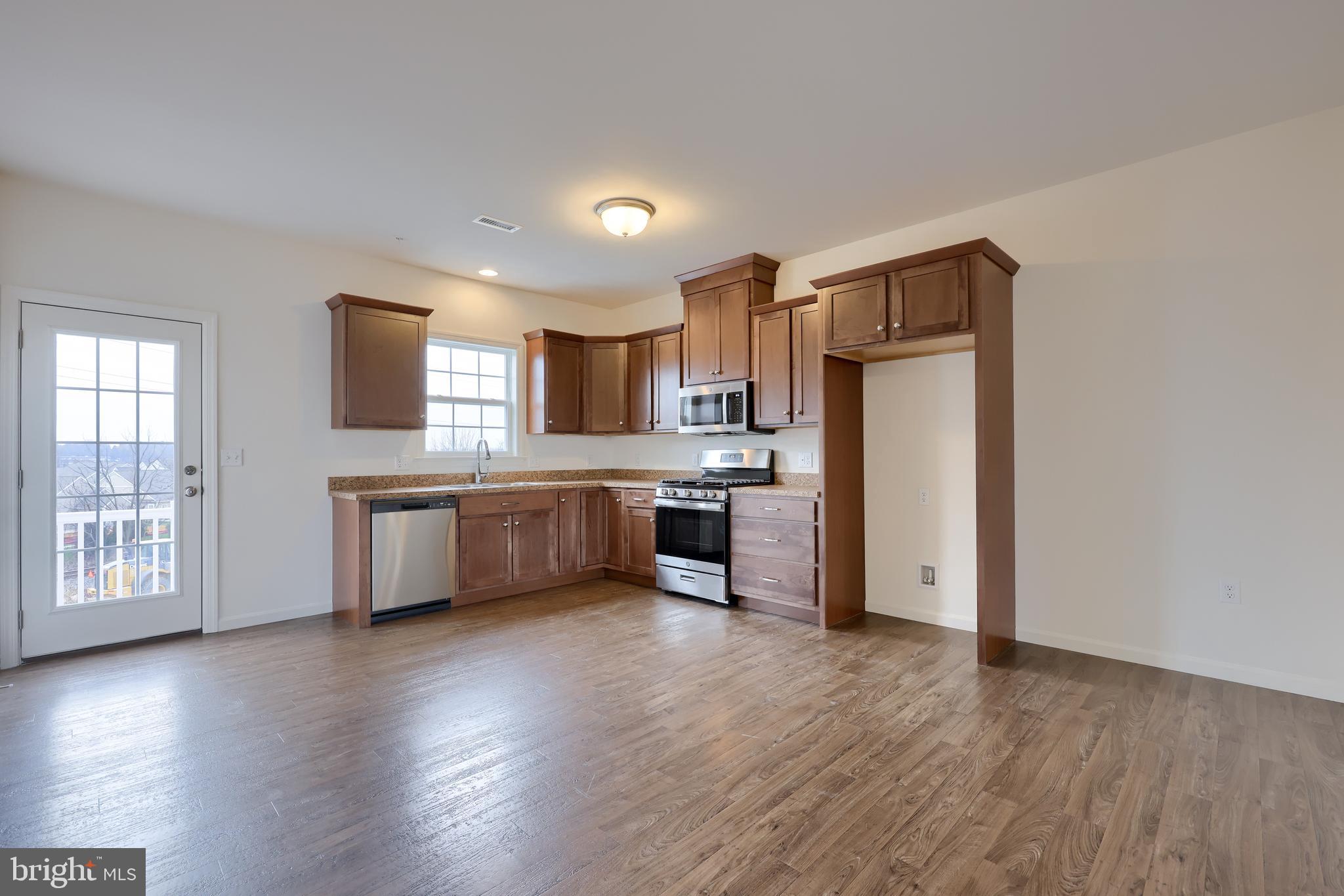 2417 Spring Water Circle Lancaster, PA 17601 - Photo 18 of 35 a kitchen with stainless steel appliances a refrigerator and a stove top oven