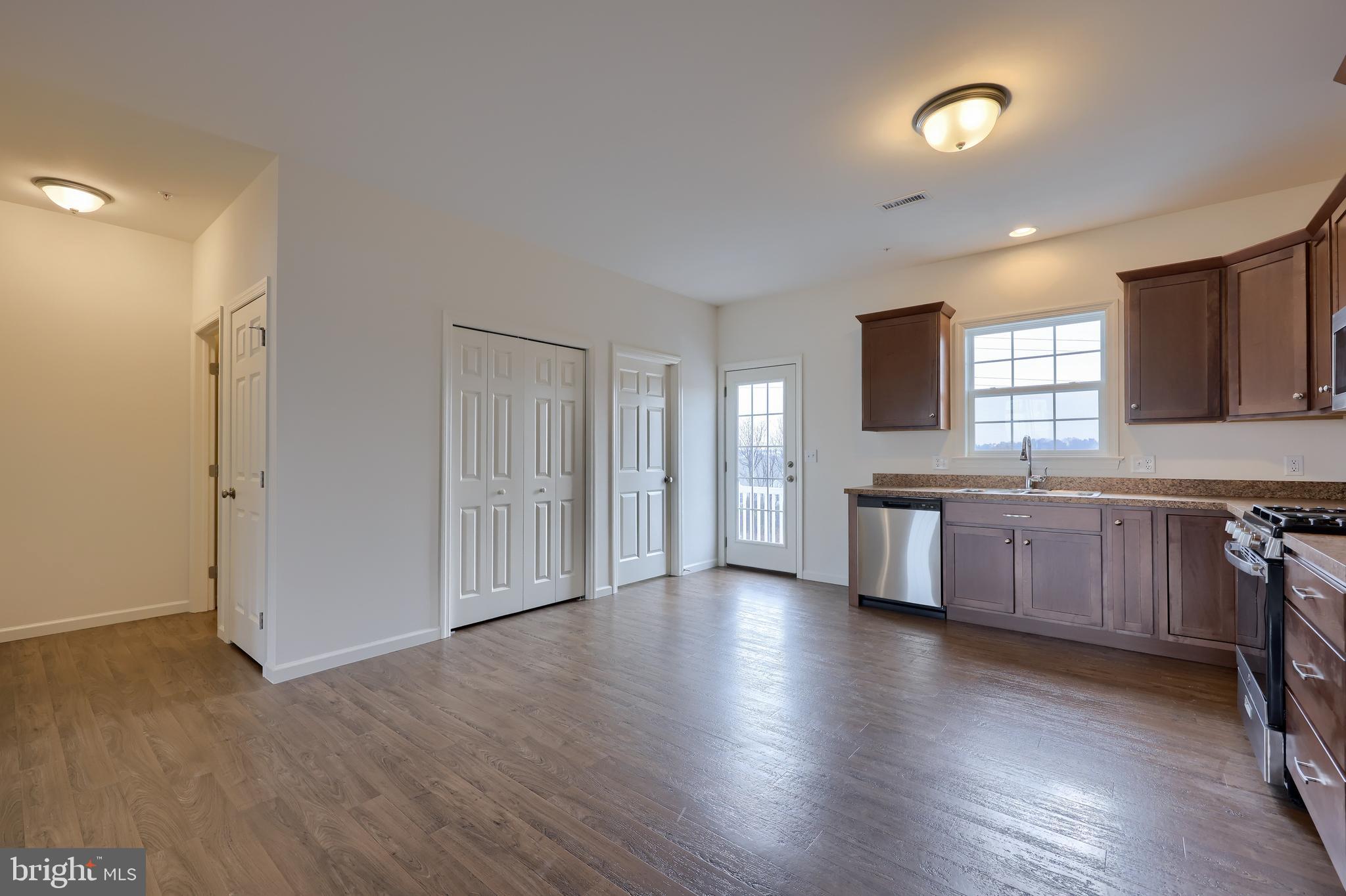 2417 Spring Water Circle Lancaster, PA 17601 - Photo 20 of 35 a large kitchen with a wooden floor and a sink