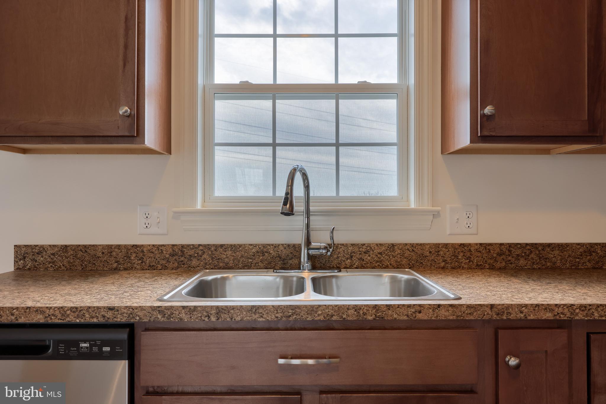 2417 Spring Water Circle Lancaster, PA 17601 - Photo 21 of 35 a kitchen with granite countertop a sink and cabinets