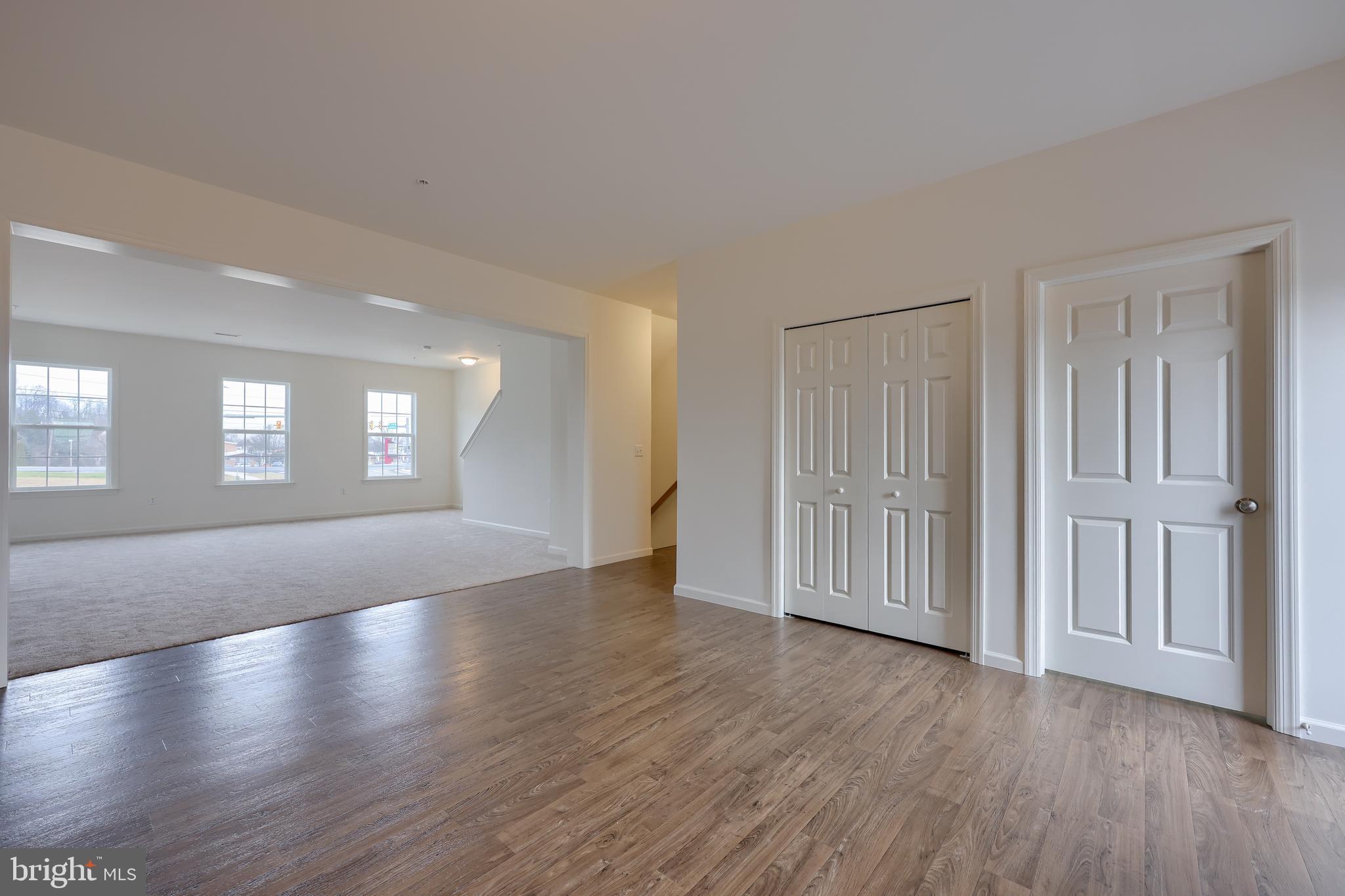 2417 Spring Water Circle Lancaster, PA 17601 - Photo 22 of 35 an empty room with wooden floor and windows