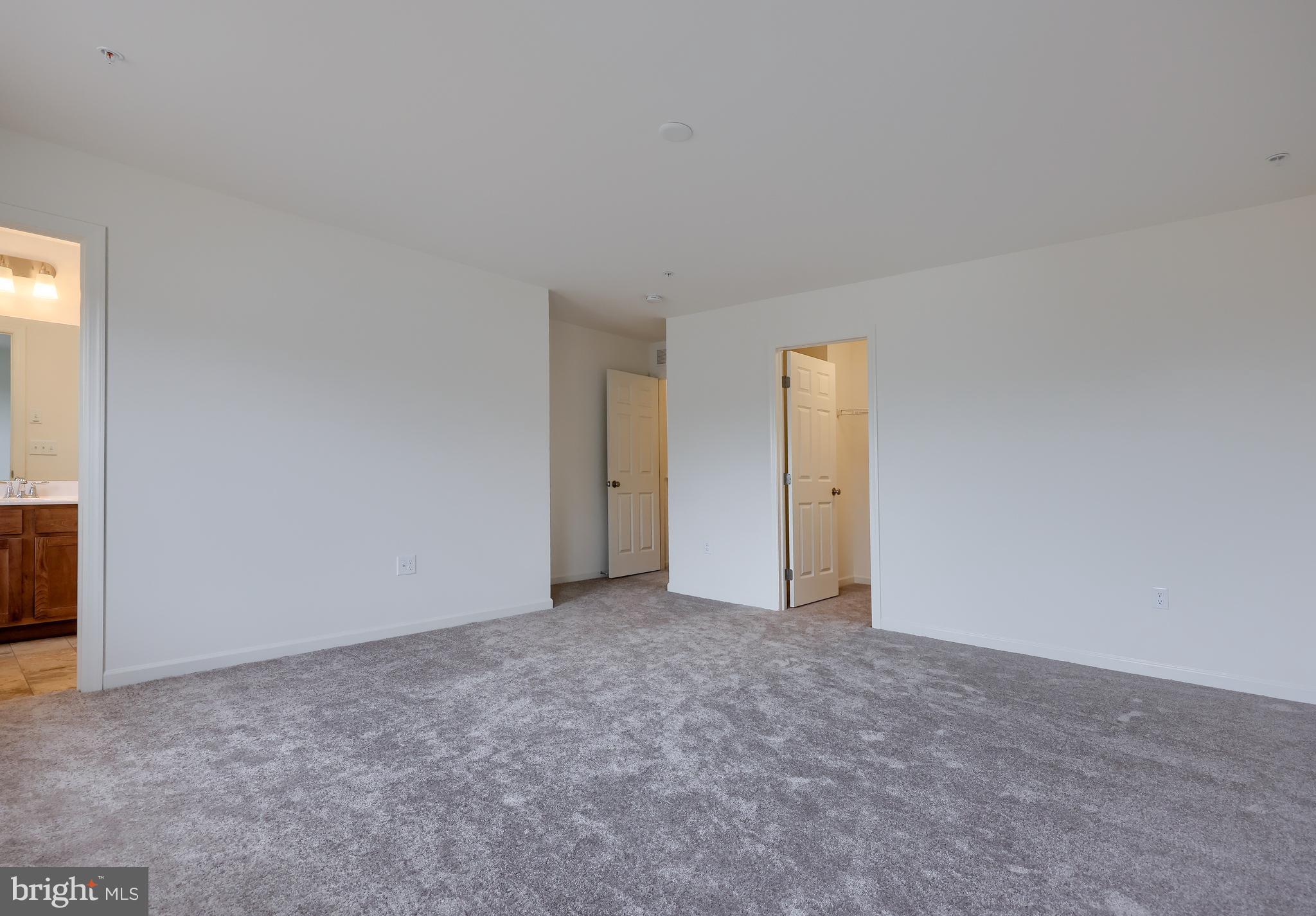 2417 Spring Water Circle Lancaster, PA 17601 - Photo 30 of 35 an empty room with an entryway door