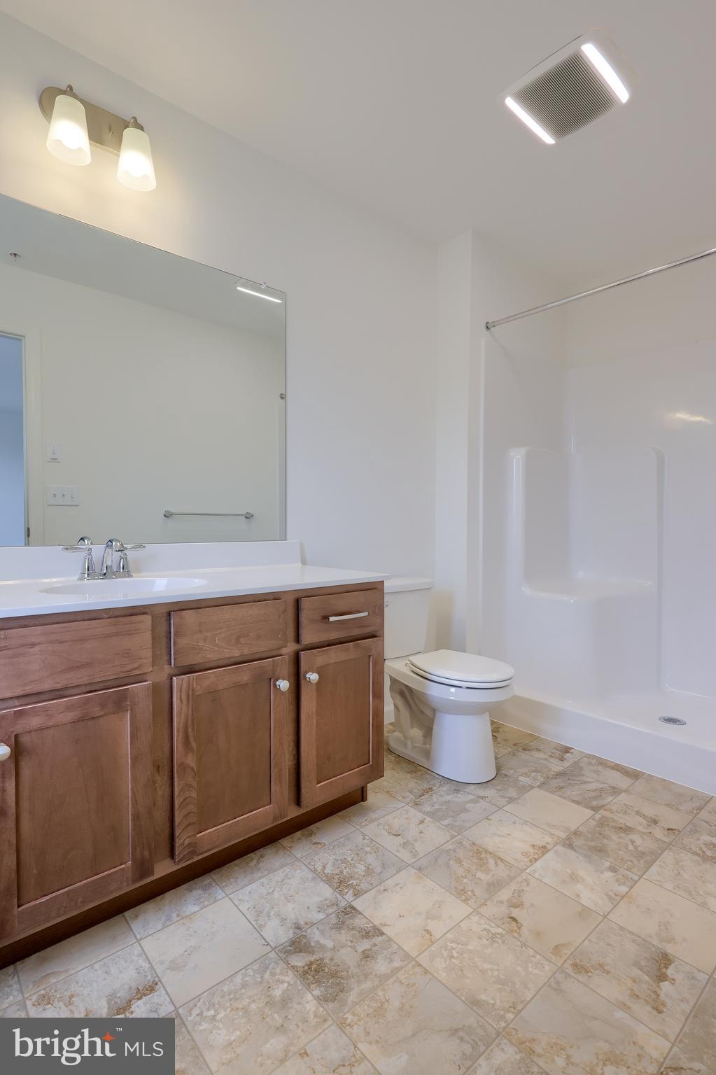 2417 Spring Water Circle Lancaster, PA 17601 - Photo 31 of 35 a spacious bathroom with a granite countertop sink a toilet and a mirror