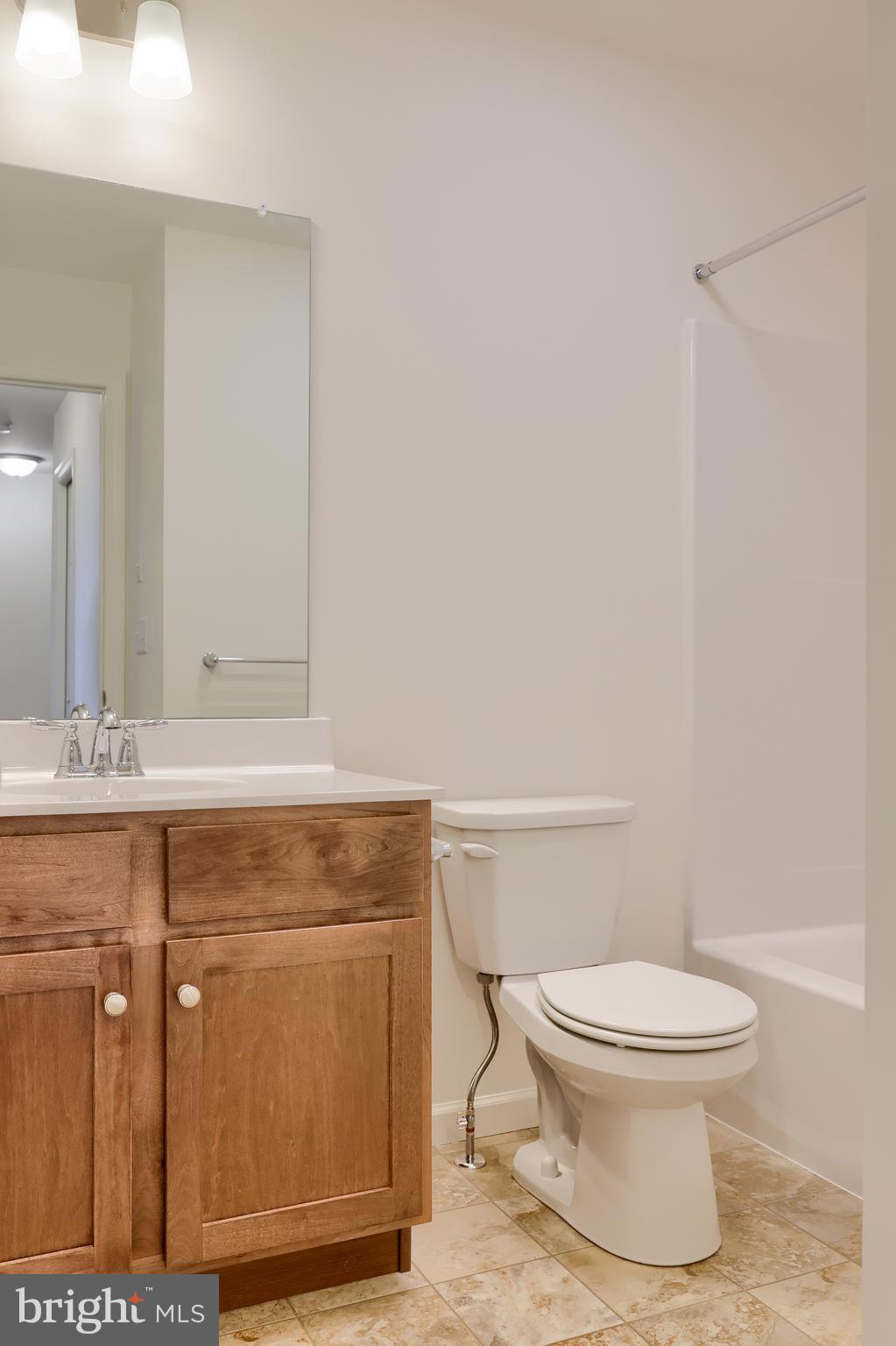 2417 Spring Water Circle Lancaster, PA 17601 - Photo 33 of 35 a bathroom with a toilet a sink and mirror