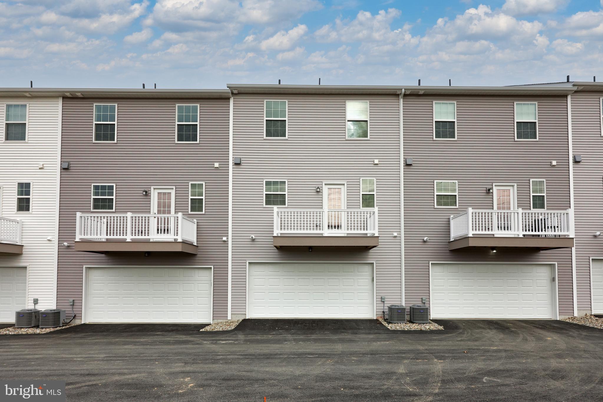 2417 Spring Water Circle Lancaster, PA 17601 - Photo 5 of 35 a front view of a building with glass windows