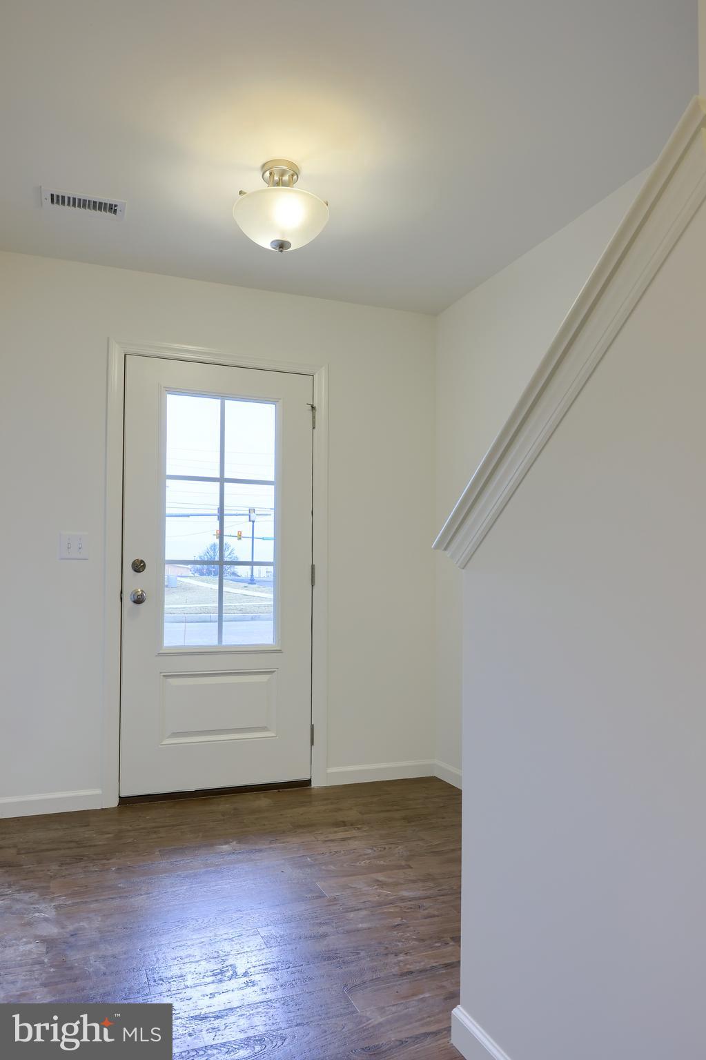 2417 Spring Water Circle Lancaster, PA 17601 - Photo 8 of 35 an empty room with wooden floor and windows