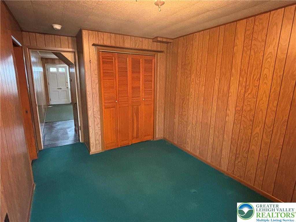 2303 4th Street Easton, PA 18042 - Photo 6 of 18 a view of an empty room with wooden floor and a window