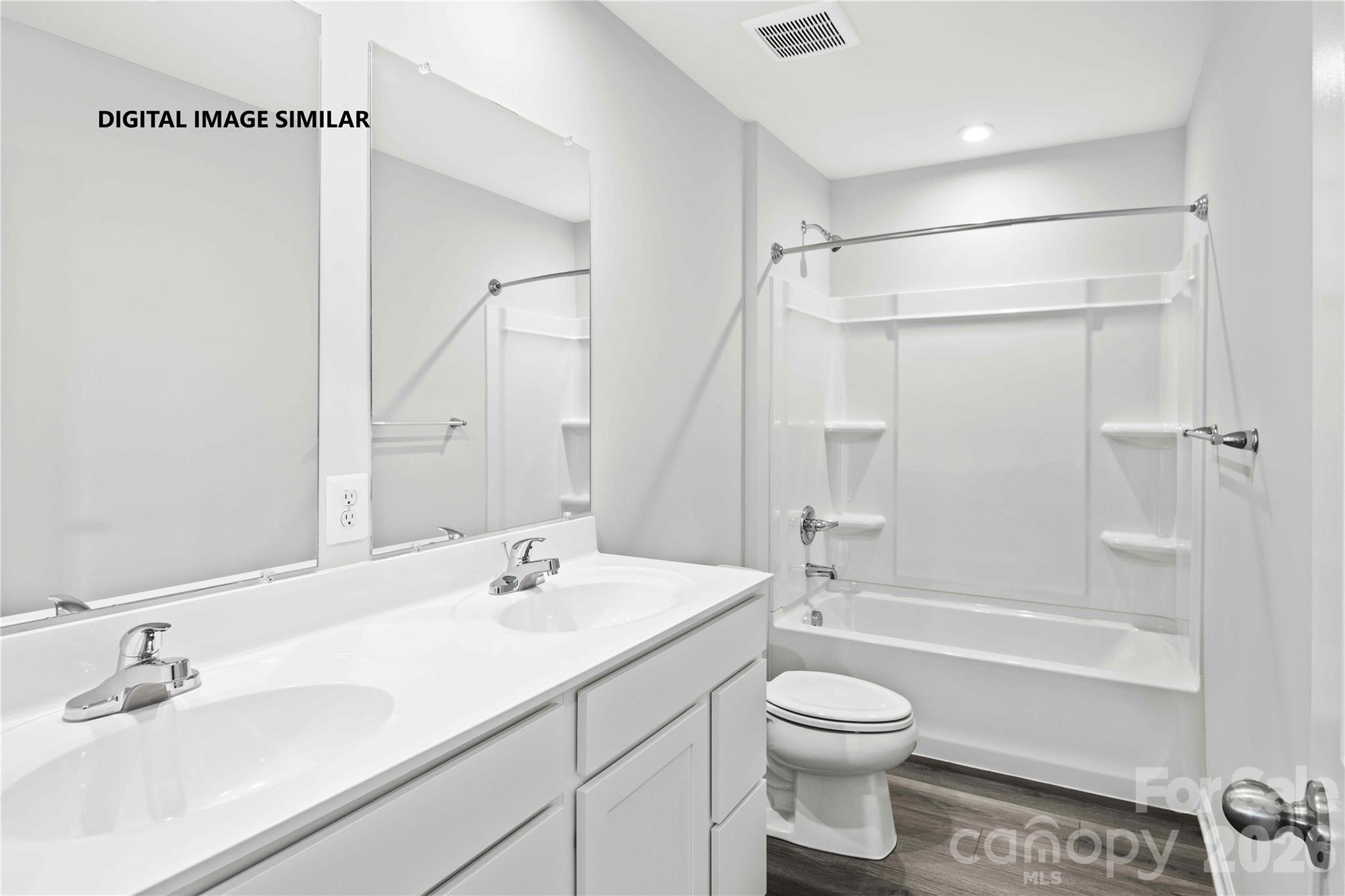 205 Maggys Way Pageland, SC 29728 - Photo 9 of 13 a bathroom with a granite countertop sink a toilet and shower
