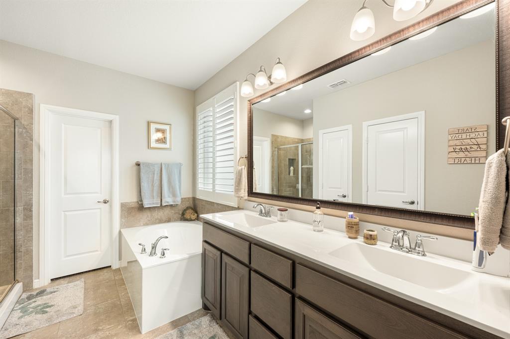 916 Falcon Road Argyle, TX 76226 - Photo 27 of 37 Bathroom with vanity, tile patterned floors, and separate shower and tub