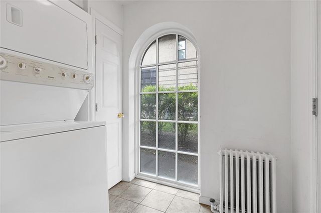 a bathroom with a toilet a sink and a mirror