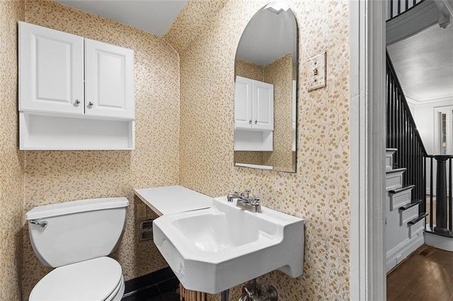 a view of a room with a window and bathroom