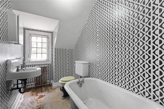 an empty room with a empty space and windows