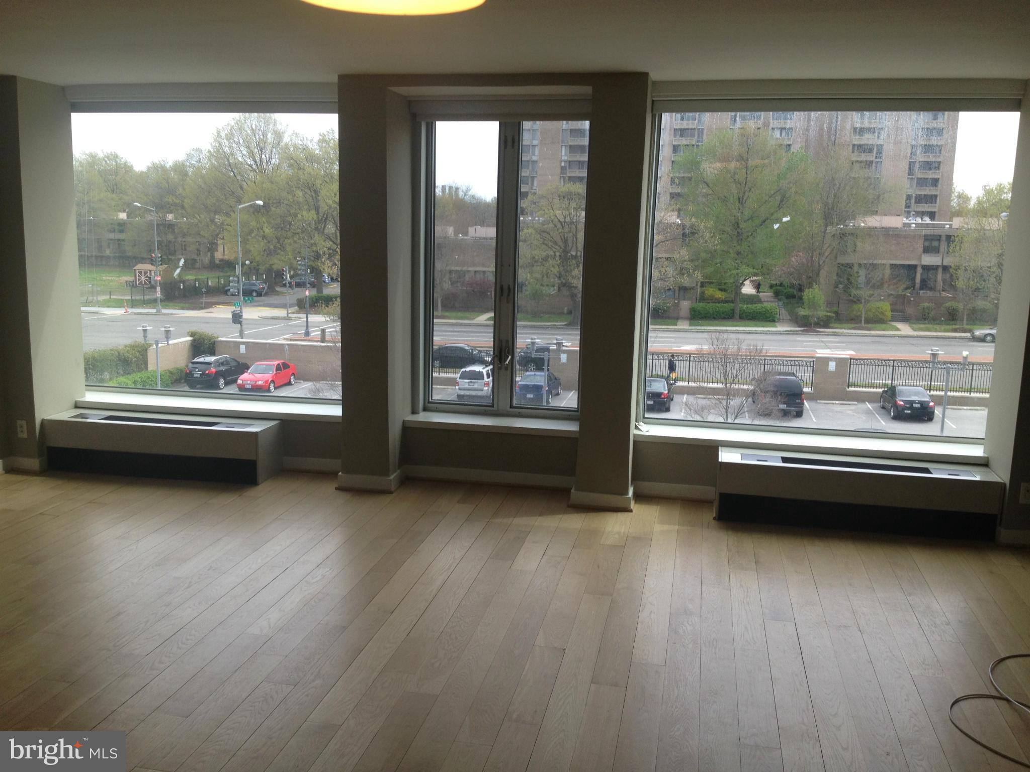 1101 3rd Street Southwest, Unit 312 Washington, DC 20024 - Photo 14 of 30 a view of a room with wooden floor and a window
