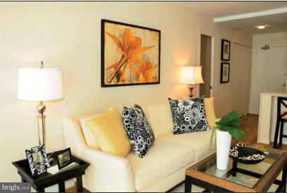 1101 3rd Street Southwest, Unit 312 Washington, DC 20024 - Photo 4 of 30 a living room with furniture and a table