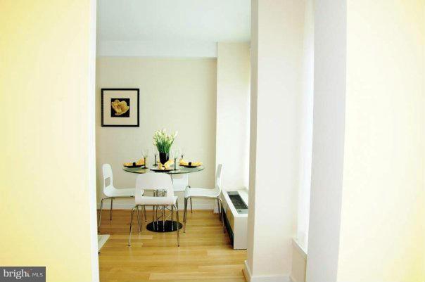 1101 3rd Street Southwest, Unit 312 Washington, DC 20024 - Photo 5 of 30 a view of a living room with a table and chairs