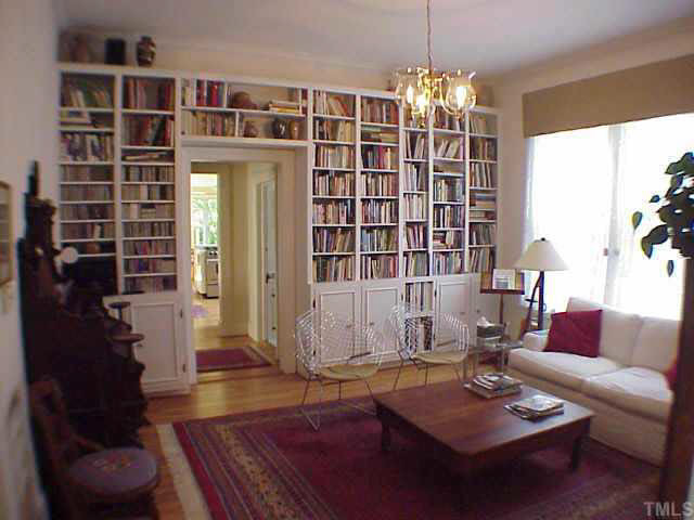 405 Polk Street Raleigh, NC 27604 - Photo 5 of 10 The library opens to the handsome dining room (not shown) and leads past the full downstairs bath to the kitchen. Other