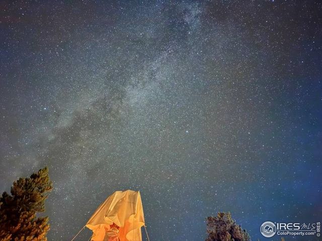 a view of a patio with wooden floor